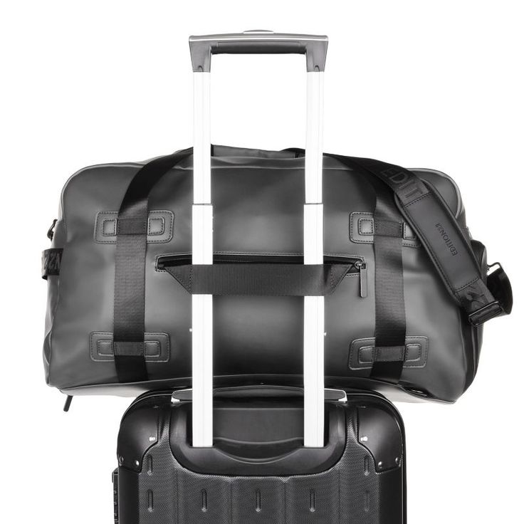 the back side of a black suitcase with wheels and straps on it, against a white background