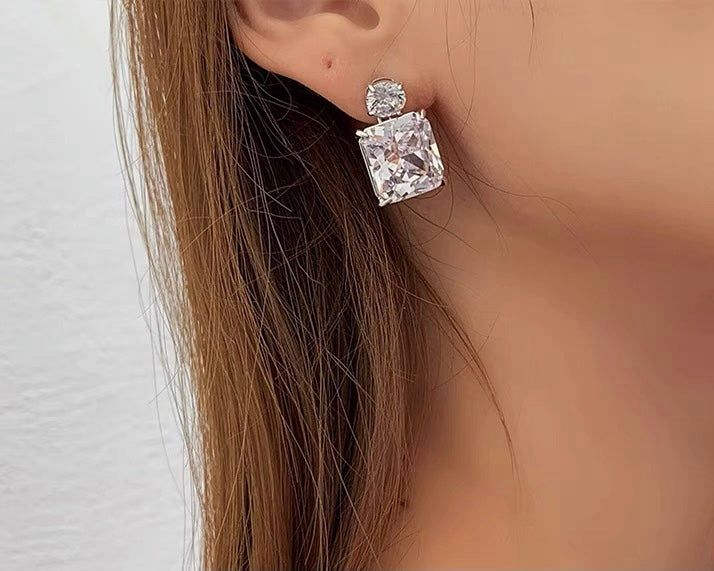 These simple yet luxurious earrings are radiant or squared cut crystals Material: platinum plating copper+cubic zirconia Ear pin: 925SILVER Weight:5.24g/pc Size:L2cm*W1.3cm Luxury Square Cut Earrings For Women, Luxury Square Cut Earrings Fine Jewelry, Luxury Octagon Cubic Zirconia Earrings, Luxury Radiant Cut Cubic Zirconia Jewelry, Luxury Cubic Zirconia Crystal Earrings, Luxury Cubic Zirconia Octagon Earrings, Luxury Brilliant Cut Cubic Zirconia Diamond Earrings, Luxury Tarnish-resistant Cubic Zirconia Earrings, Luxury Elegant Square Cut Earrings