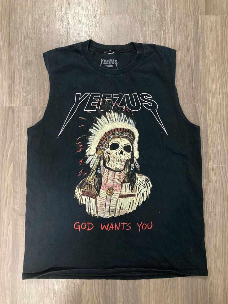 a black shirt with an image of a skeleton wearing a headdress on it