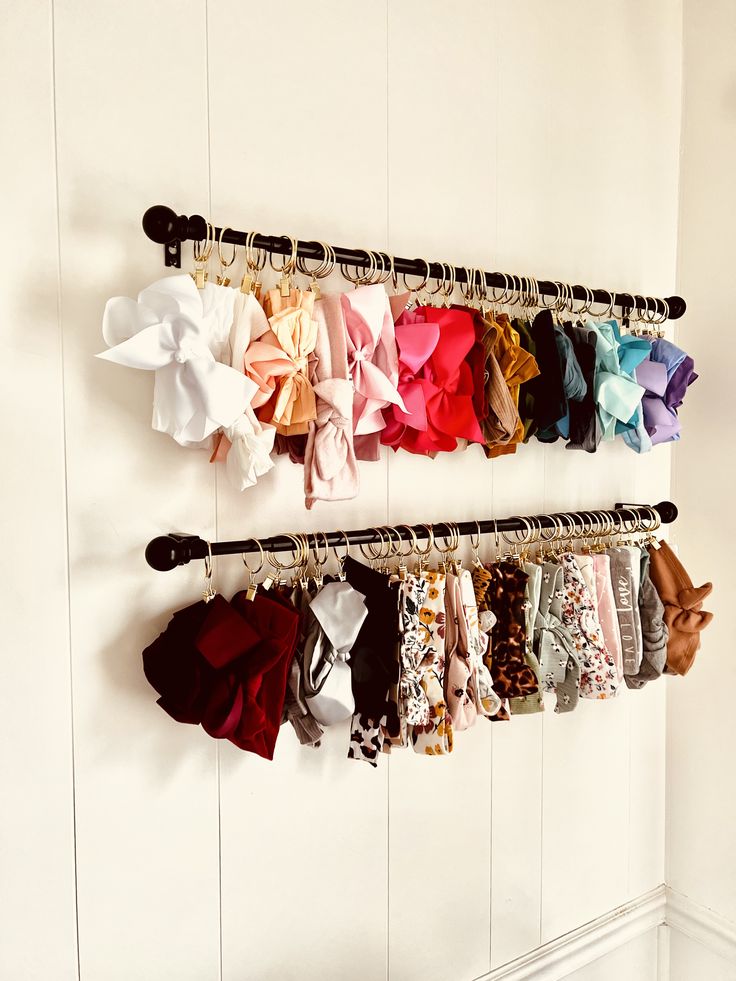 there is a rack full of clothes hanging on the wall