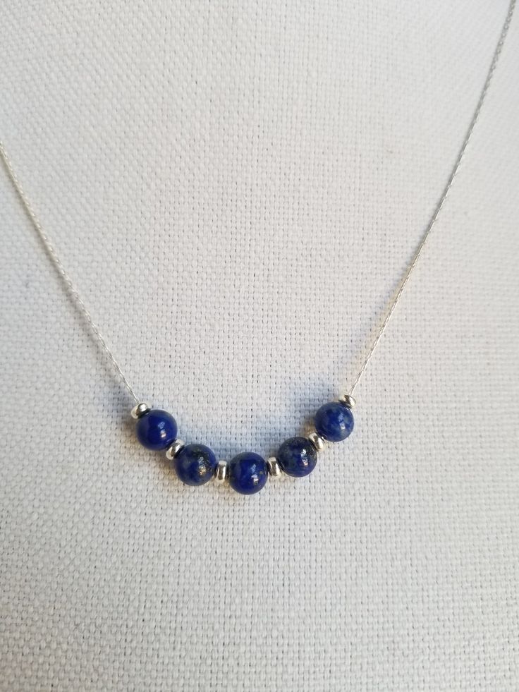 Simple but lovely lapiz lazuli andssterling silver necklace.  Can be made to your desired length. Everyday Lapis Lazuli Jewelry With Gemstone Beads, Blue Sterling Silver Necklaces With Silver Beads, Blue Sterling Silver Necklaces With Round Beads, Blue Sterling Silver Necklace With Silver Beads, Blue Sterling Silver Necklace With Polished Beads, Lapis Lazuli Jewelry With Silver Beads For Gifts, Lapis Lazuli Gemstone Beads Necklace In Silver, Silver Lapis Lazuli Necklace With Gemstone Beads, Silver Lapis Lazuli Necklace With Polished Beads