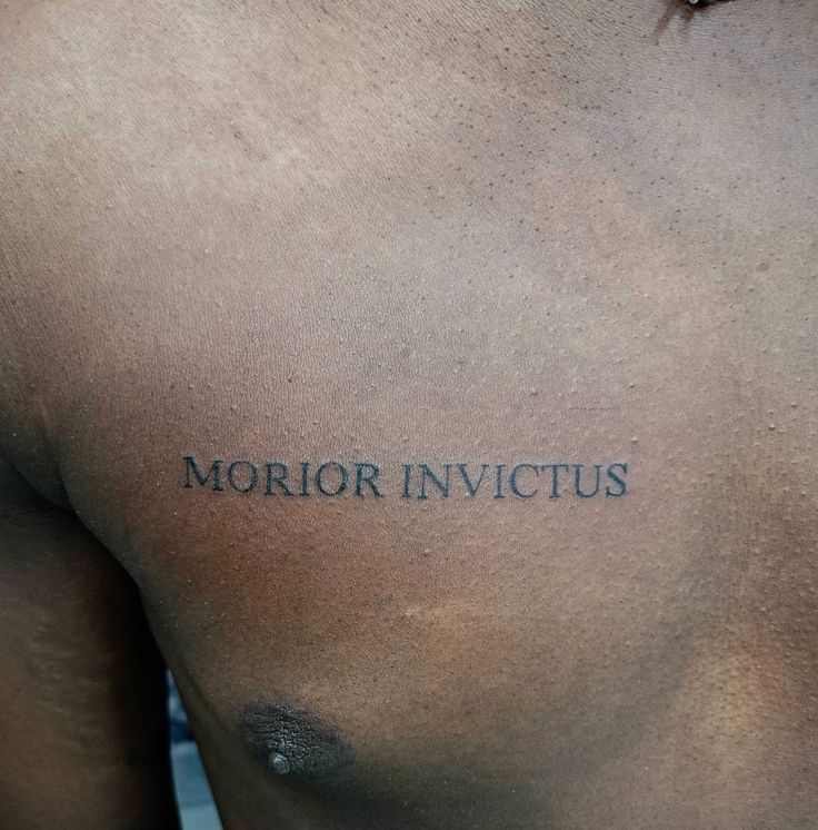 the back of a man's chest with an inscription on it that reads, mirror in