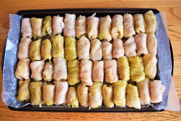 some food is laying out in a pan on a wooden table and ready to be eaten