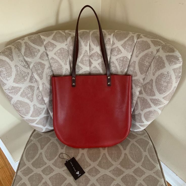 Gorgeous Simple, Slim Tote By Kiko. Measurements W 13.5 H 12.75 Handle Drop 10.5. Cherry Red With Rounded Bottom Curves. This Bag Is Nwt And Is In Near Perfect Condition. Tiny Ink Mark On Back Of Bag And Natural Leather Marking As Well. Please Look Closely At Pics. Everyday Red Shoulder Bag With Leather Lining, Red Shoulder Bag With Leather Lining For Everyday, Red Leather Lining Shoulder Bag For Everyday, Red Shopping Bags With Leather Lining, Everyday Red Bag With Leather Lining, Red Leather-lined Bags For Shopping, Red Leather-lined Bag For Everyday Use, Red Leather Shoulder Bag For Daily Use, Red Leather Lined Bag For Everyday