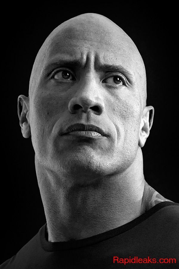 a black and white photo of a bald man