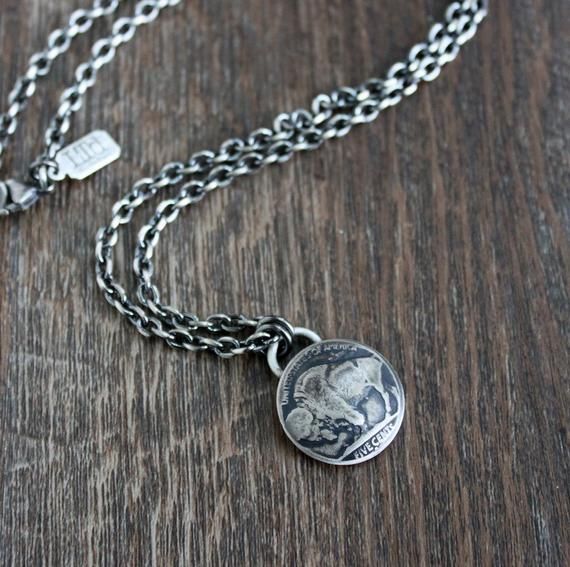 A vintage Buffalo Nickel coin has been forged into a pendant for this men's chain necklace. The nickel has been domed, giving it more dimension, and then oxidized and sanded to bring out all the incredible detail. It hangs from strong drawn cable chain chain and is secured with a lobster clasp.Please use guide in last photo to choose your chain length from the drop down menu.See this pendant necklace with the Indian (as shown in last photo) here https://www.etsy.com/listing/905271571/indian-head Blue Crystal Necklace, Faith Necklace, Buffalo Nickel, Bear Necklace, Mens Chain Necklace, Swarovski Crystal Necklace, White Gold Necklaces, Gold Necklace Women, Gemstone Necklace Pendant