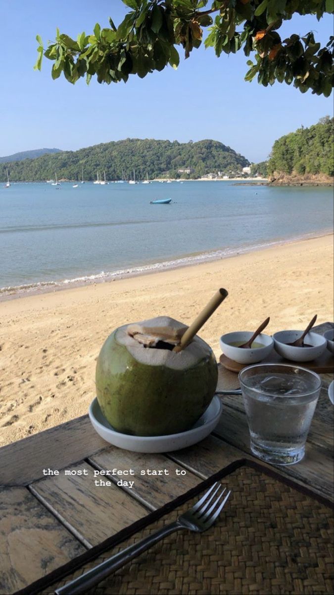 there is a coconut on the table at the beach