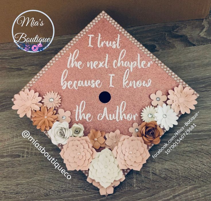 a pink and white graduation cap with flowers on it that says, i trust the next charter because i know the author