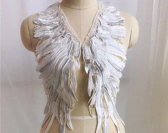 a mannequin with white wings on it