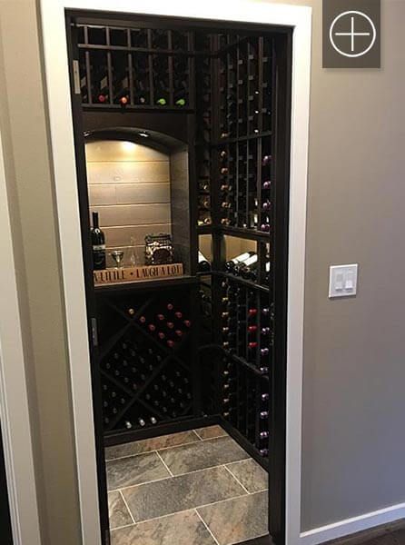 an open wine cellar door in a home