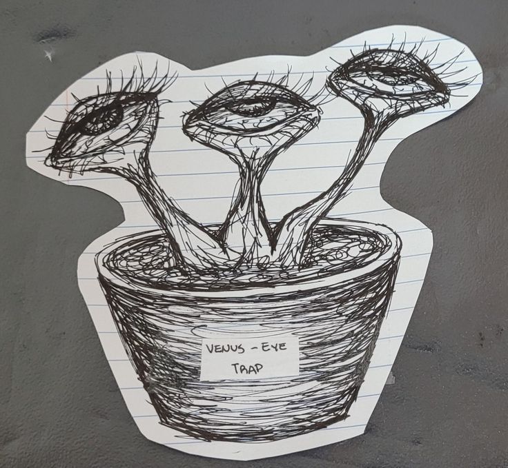 a drawing of three flowers in a pot on a piece of paper with writing underneath