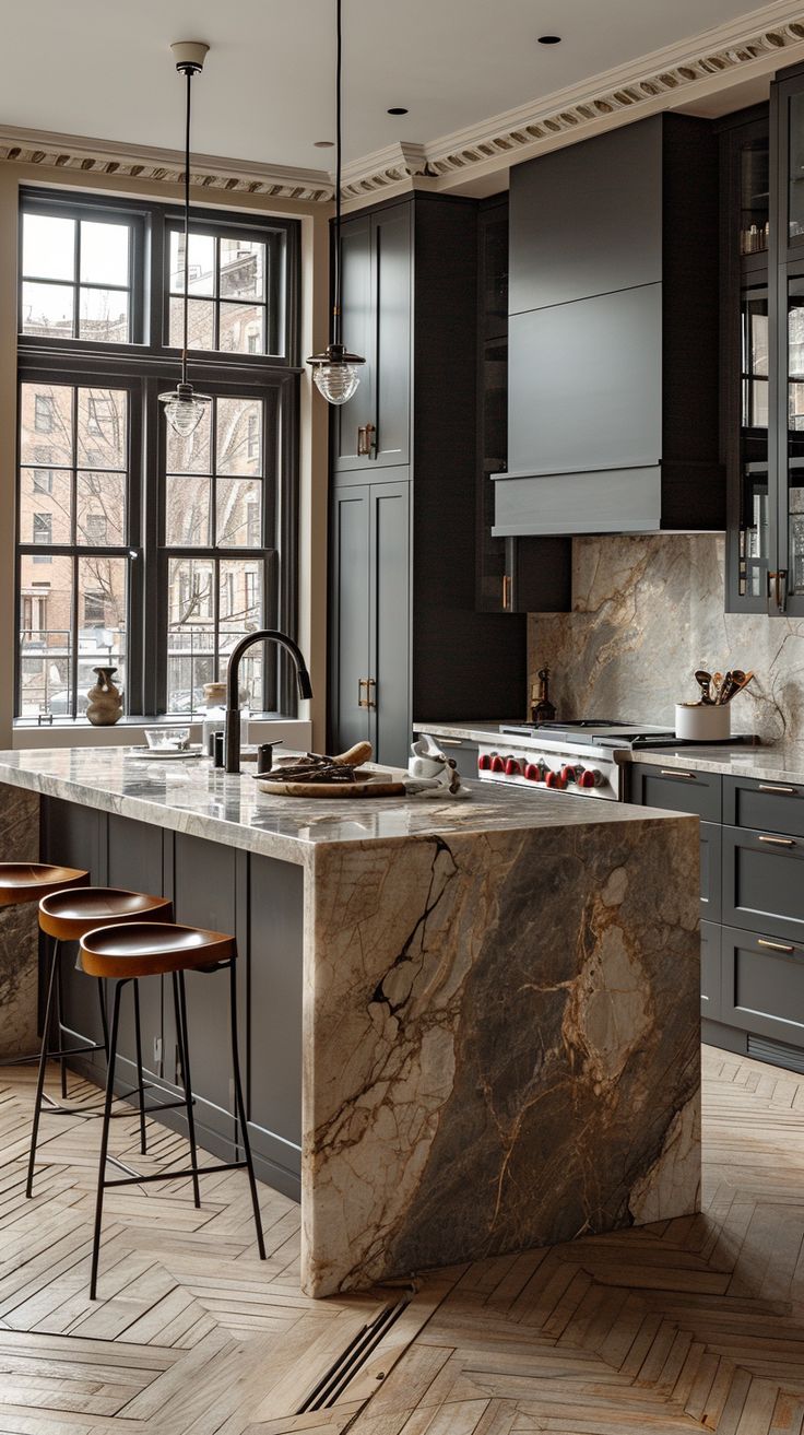 a large kitchen with marble counter tops and wooden stools in front of an open window