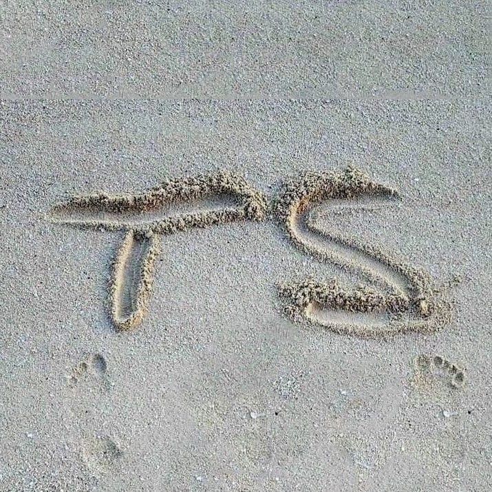 the word love is written in the sand