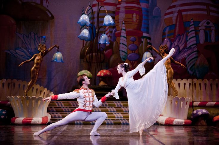 two dancers in white and red outfits on stage with text that reads dana benon and vicachev buchlosky by ferry shopio