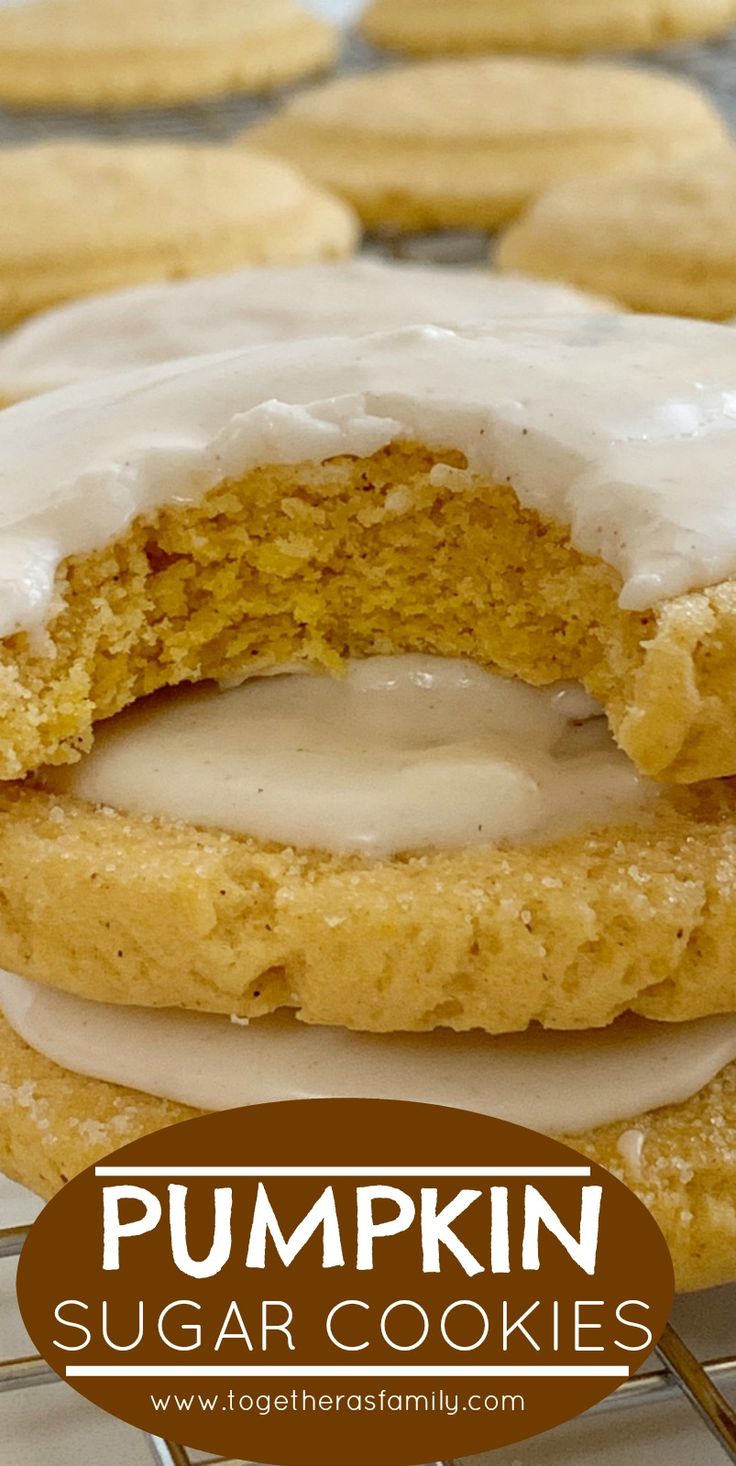 pumpkin sugar cookies with icing on a cooling rack