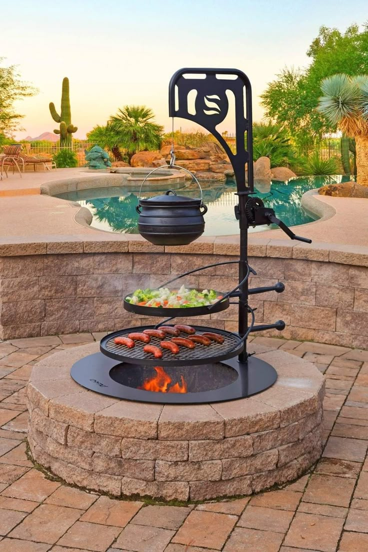 an outdoor bbq grill with food cooking on it in front of a swimming pool