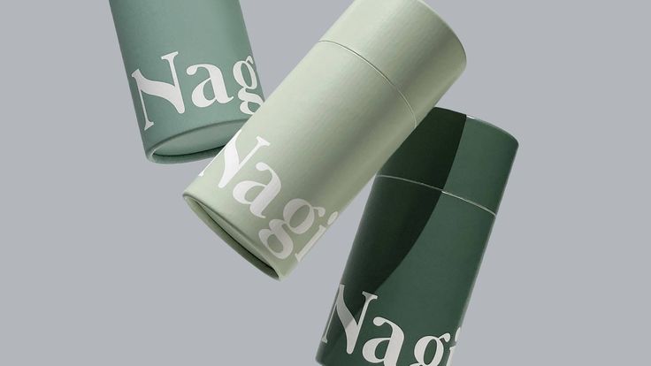 two green and white vases with the words nagg on them are flying through the air