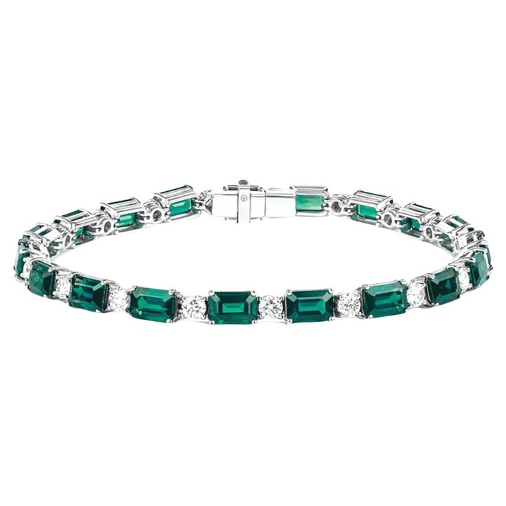 Emeralds and diamond Gemstone Type: Emerald-Cut; Number of Gemstones: 19 Weight of Gemstone: 13 Number of Diamonds: 19 Weight of Diamond: 2 Platinum is the metal. Formal Emerald Gemstone Bracelets, Luxury Cubic Zirconia Bracelets With Stones, Luxury Diamond Bracelets With Stones, Luxury Emerald Gemstone Tennis Bracelet, Elegant White Gold Diamond Bracelet With Emerald, Exquisite Diamond Gemstone Bracelets, Elegant Diamond And Emerald Bracelet With 17 Jewels, Formal Diamond Gemstone Bracelets, Formal Diamond Jewelry With Handset Stones