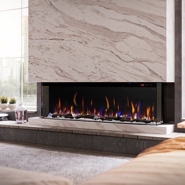 Designed to impress, the IgniteXL® Bold Linear Electric Fireplace features flexible and industry unique display options including front-facing, right or left corner and bay installations. This modern, built-in fireplace comes with a patented mirror effect that increases depth, plus advanced controls to maximize customization and enjoyment. Get creative and connect multiple units together for a dramatic statement. Think big, think bold! Ignite XL BOLD Is Available In Five Sizes: 50", 60", 74", 88 Dimplex Ignite Xl Bold, Built In Fireplace Ideas, Modern Fireplace Vaulted Ceiling, Electric Fireplace In Dining Room, Slab Fireplace Surround, Ventless Gas Fireplace Ideas, Large Tile Fireplace, Gas Linear Fireplace, Modern Fireplace Wall Living Room