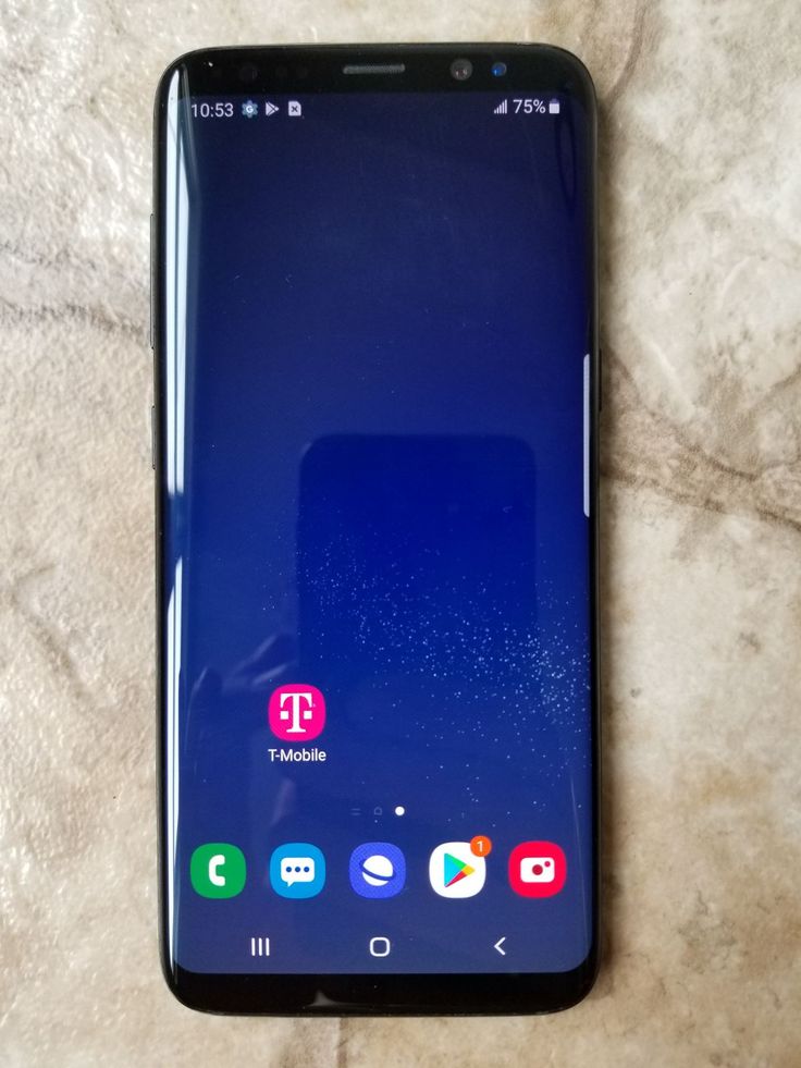 the back side of an lg phone on a marble surface, with icons displayed