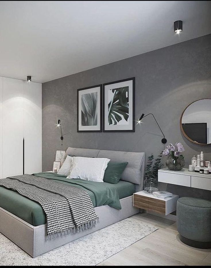 a bedroom with grey walls and green bedding in the middle, white rugs on the floor