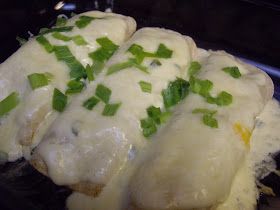 the food is covered with cheese and green onions