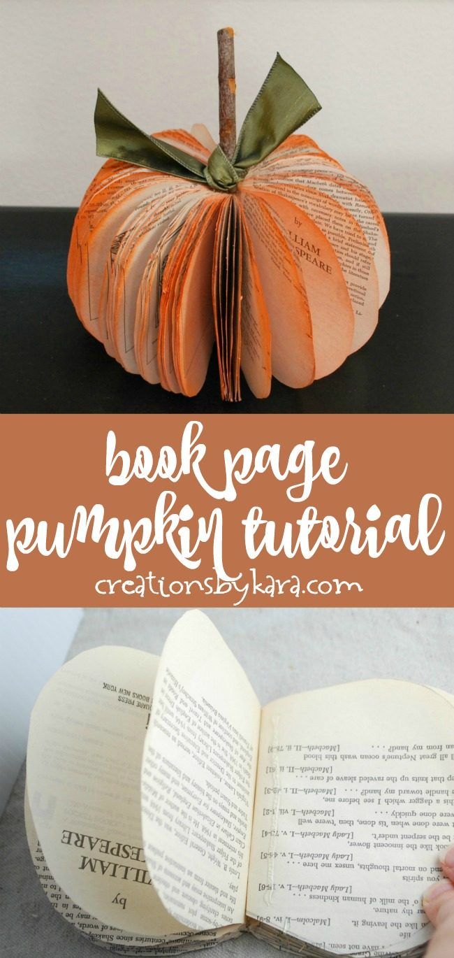 an open book sitting on top of a table next to a pumpkin shaped like a book