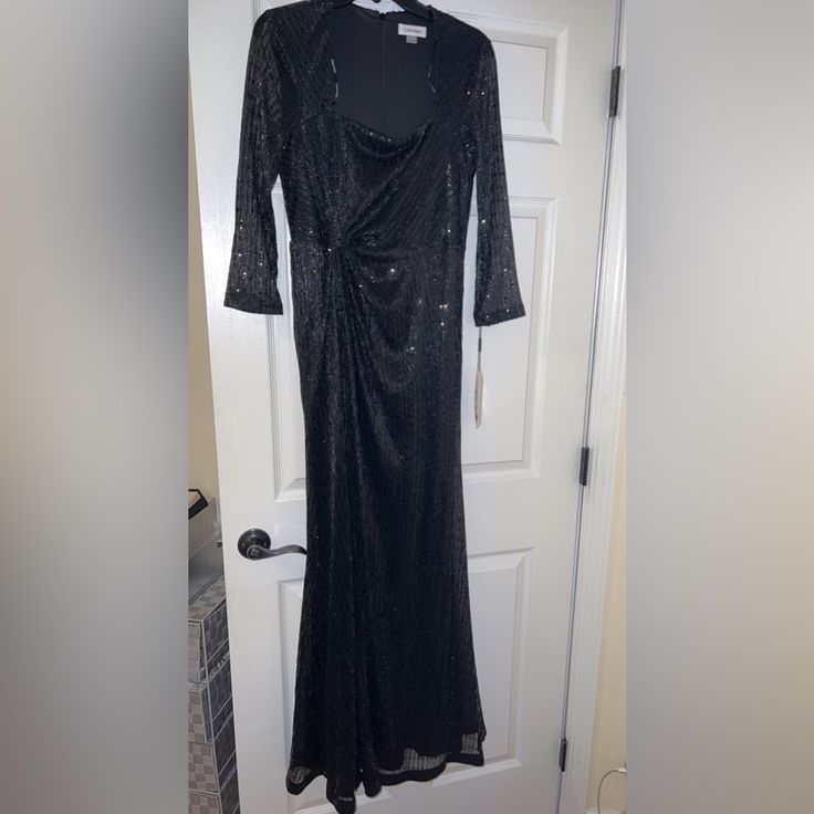 Stunning New With Tags Calvin Klein Long Black Sequin Dress. Sheer Three Quarter Length Sleeves. Fitted Mermaid Style With A A Bit More Length In The Back. Please Message Me If You Have Any Other Questions. Square Neckline. Size 8 Fitted Calvin Klein Maxi Dress For Evening, Calvin Klein Black Evening Dress, Calvin Klein Black Cocktail Dress, Elegant Calvin Klein Maxi Dress For Party, Elegant Calvin Klein Evening Maxi Dress, Calvin Klein Elegant Evening Maxi Dress, Fitted Calvin Klein Evening Dresses, Fitted Calvin Klein Party Dress, Calvin Klein Fitted Party Dress