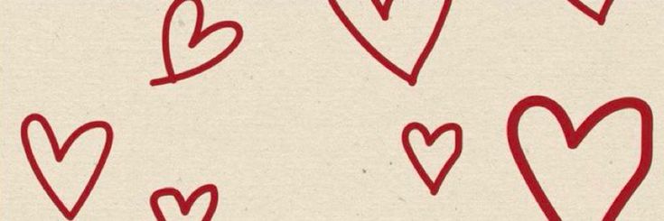 hearts drawn in red on white paper