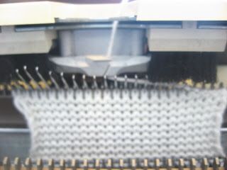 a close up view of a machine that is working on some kind of cloths