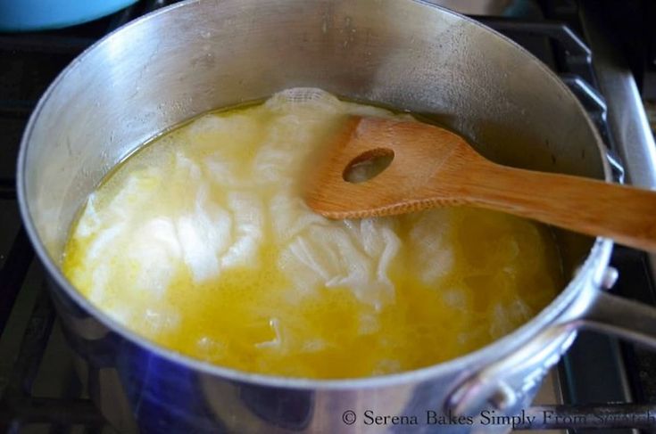 a wooden spoon in a pot on the stove