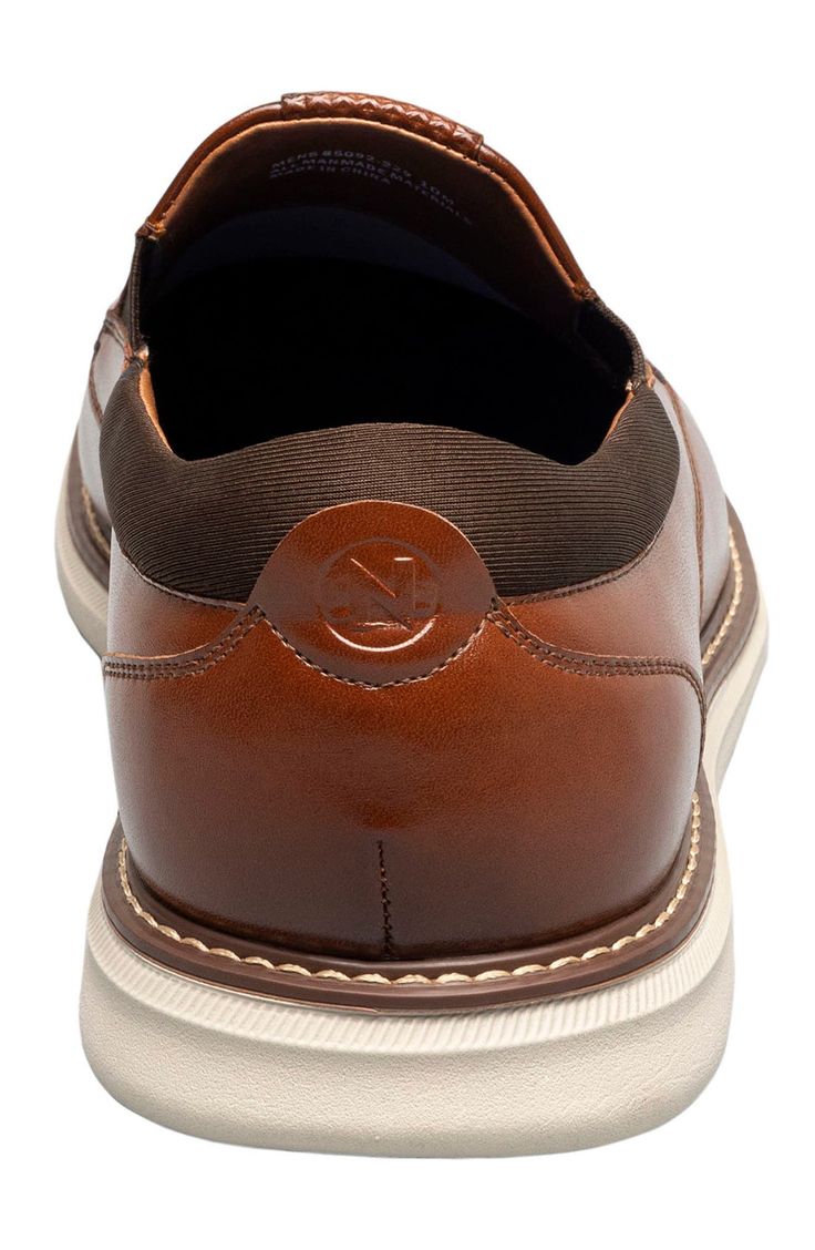 Clean topstitching lends handsome style to this sleek slip-on fitted with a cushioned footbed and shaped by a classic moc toe. Synthetic upper and lining/rubber sole Imported Business Casual Brown Slip-ons With Leather Lining, Brown Plain Toe Slip-ons For Business Casual, Classic Brown Slip-ons With Cushioned Footbed, Brown Moc Toe Slip-ons For Business Casual, Brown Moc Toe Slip-ons With Leather Lining, Brown Moc Toe Slip-on Shoes, Business Casual Slip-ons With Cushioned Footbed And Moc Toe, Business Casual Cushioned Moc Toe Slip-ons, Brown Moc Toe Slip-ons With Cushioned Footbed