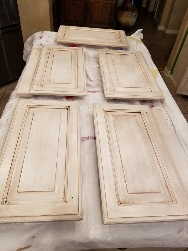 four white doors sitting on top of a table