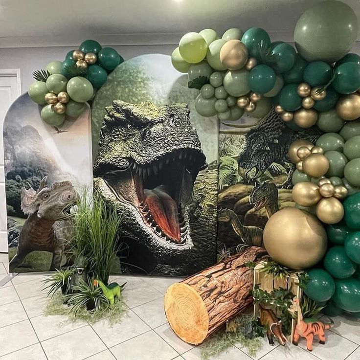 balloons and decorations are set up on the floor for a dinosaur themed birthday party in an office