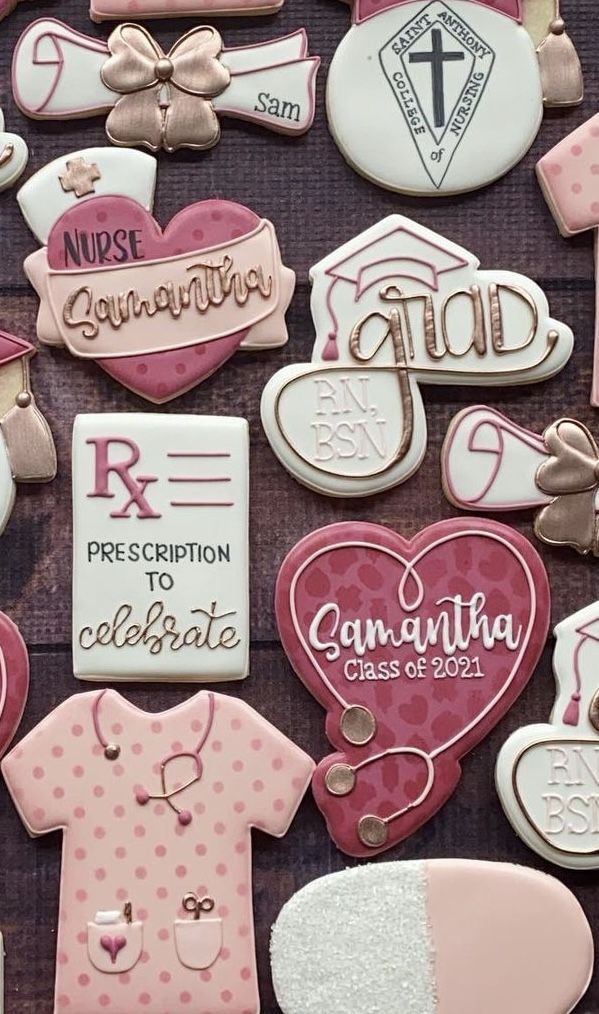 decorated cookies are arranged in the shape of heart and nurse's emblems on display