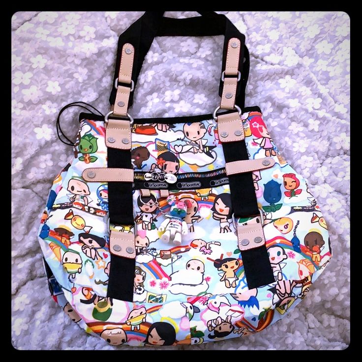 Reposhing This Tokidoki Lesportsac Bag I Purchased From @Sbn98xo. I Have Never Used It. It's A Great Bag But I Have Too Many Tokidoki Bags And Have Never Used This One As I Prefer Crossbodies. Measurements: 12" Wide, 10" Height, 5" Across The Bottom, 9" Drop. Questions? Leave A Comment Below! Playful White Shoulder Bag For Everyday Use, Fun Satchel Shoulder Bag For School, Fun Tote Shoulder Bag For School, Trendy Backpack For Playtime, Playful White Shoulder Bag For Everyday, White Fun Shoulder Bag For Travel, Fun White Shoulder Bag For Travel, Casual Bags With Character Print For Daily Use, Playful White Bags For Everyday Use