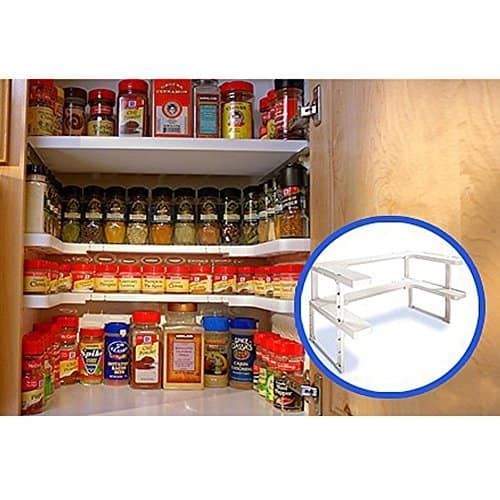 an open spice rack with spices and condiments