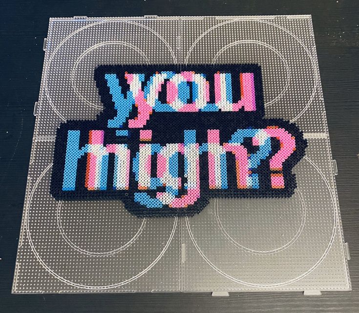 a piece of pixel art with the words you shine? written in blue and pink