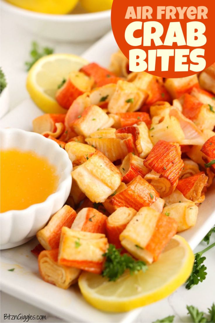 air fryer crab bites on a white plate with lemon wedges and parsley