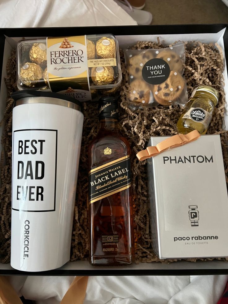 an open gift box containing coffee, chocolates, cookies and other items for father's day