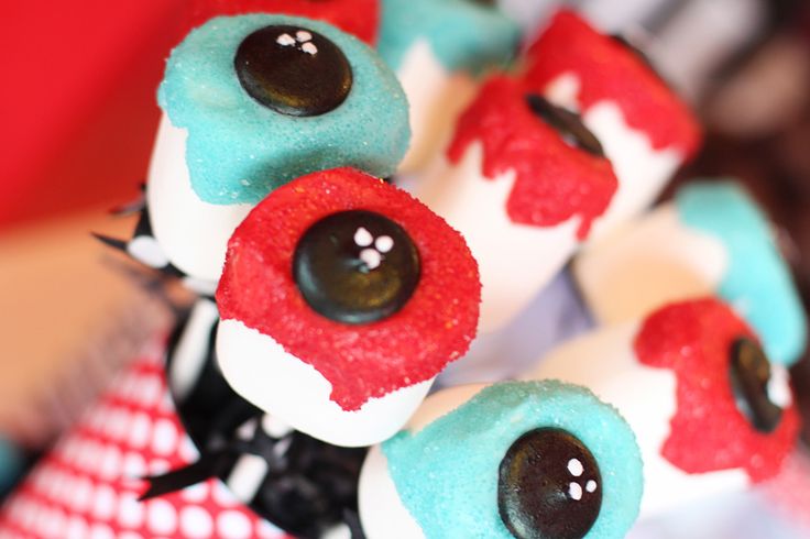 red, white and blue cupcakes with eyes on them