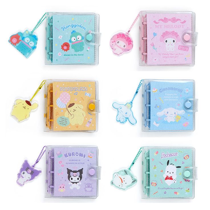 four small notebooks with different designs and tags attached to the covers are lined up on top of each other