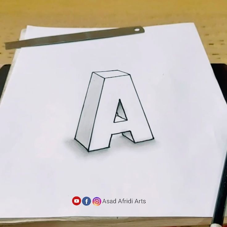 the letter a is drawn on top of a piece of paper with a pencil next to it