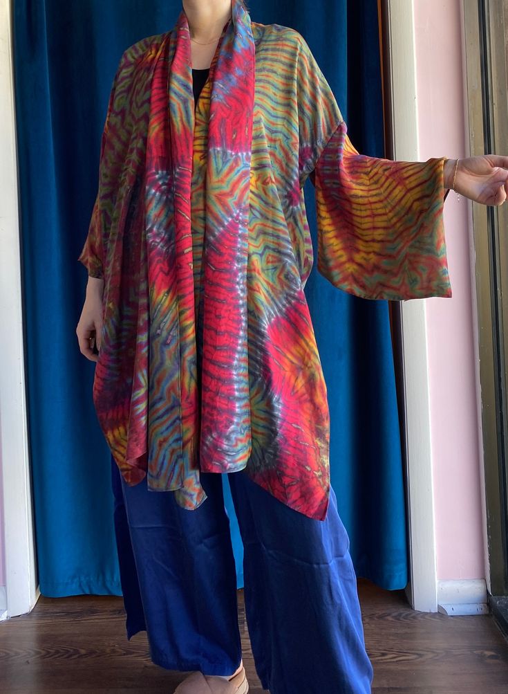 Stunning silk kimono!! The rainbow pattern is the perfect pop of color to wear with your more neutral pieces. Can be worn with the belt tied around waist or as a scarf. Measurements: Small: Bust: 60" Length from Shoulder to Hem: 39.5" Fabric Content: 100% Silk Carter Smith, Silk Kimono, Rainbow Pattern, Kimono Top, Color Pop, Silk, Women's Top, Fabric, Pattern