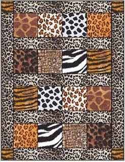 an animal print quilt with different colors and patterns