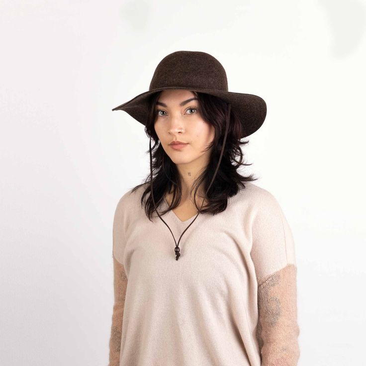 Out on the town or playing in the country, the Tegan wide brim hat fits right in with its sophisticated, felted wool look. The women's wide-brim hat has a faux suede cord on the front that threads through the sides and around the chin with an adjustable wood bead. Contrast topstitching accents the refined style. Wide brim felted wool Faux suede chin cord with wood bead Elastic sweatband for fit Felted wool Spot Clean Soft inner sweatband Brim length: 8 cm One size; Women's-specific fit Womens Wide Brim Hats, Swimsuit With Shorts, Women's Headwear, Casual Cap, Suede Cord, Quality Hats, Swimsuit Dress, Felted Wool, Wide Brimmed Hats