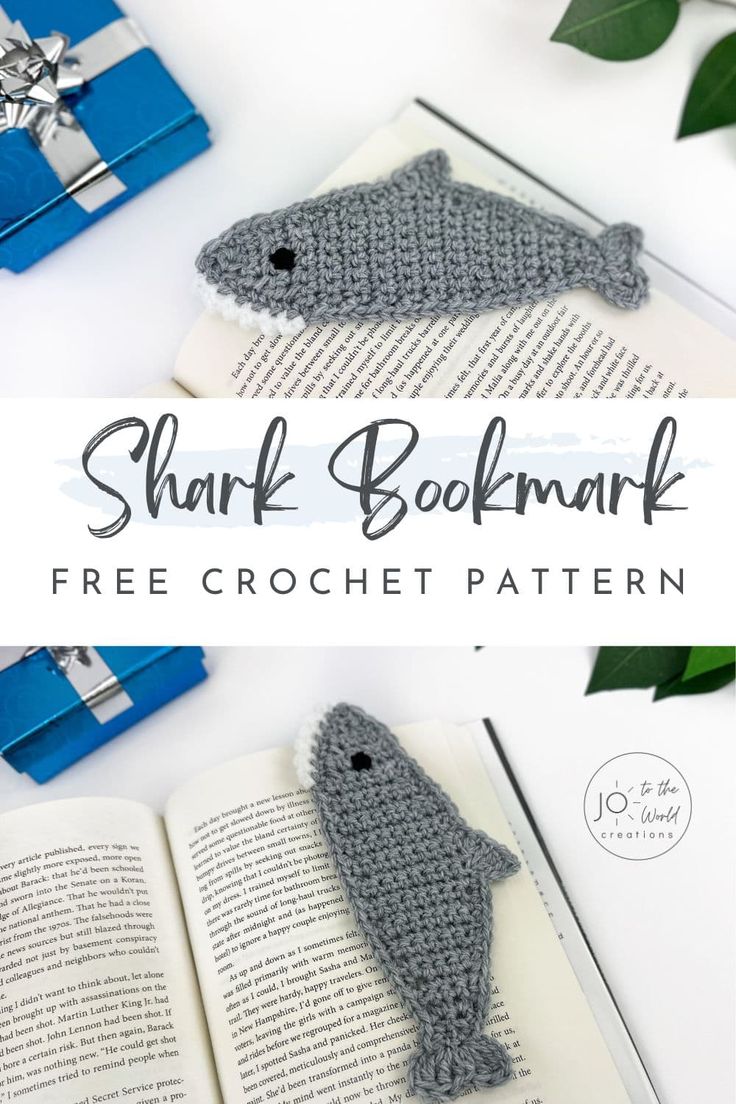 a crocheted shark bookmark on top of an open book