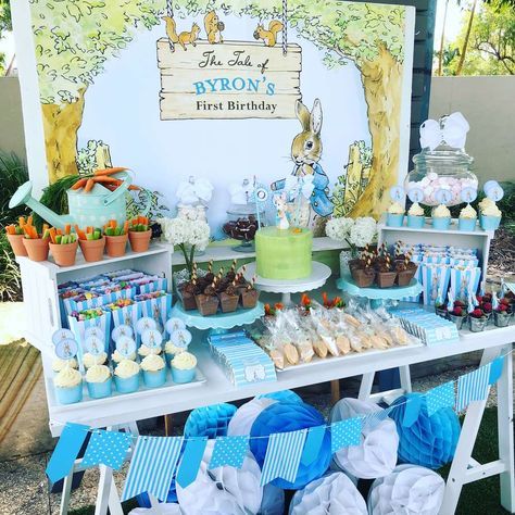 a table topped with lots of desserts and cupcakes on top of it