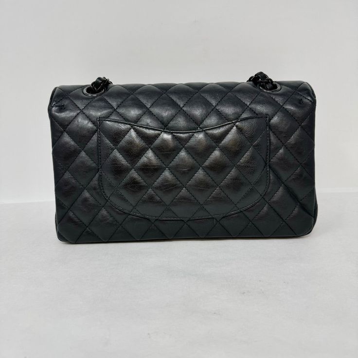 Chanel Classic Medium Double 2017 - 2018 Flap Bag with Black Hardware, Turn-Lock Closure at Front (includes Dustbag, Box and Authenticity Card) Designer = Chanel Color = Black Material = Leather Condition = Good Height = 6 Width = 10 Depth = 3" Class = Premier Location: Wilmette Item Number: 20201-62 Item ID: 300612 Category: Shoulder Bag High-end Black Bag With Removable Pouch, High-end Bags With Cc Turnlock Closure And Double Flap, High-end Black Bags With Detachable Strap, High-end Black Bags For Daily Use, High-end Black Bag For Daily Use, Classic Travel Bag With Cc Turnlock Closure, Designer Black Top Handle Bags, High-end Black Rectangular Bags, Black Double Flap Bag For Daily Use