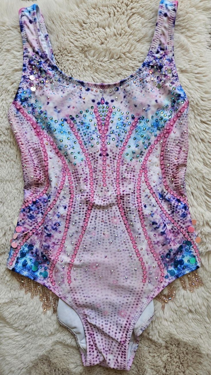 a pink and blue bodysuit with sequins on it